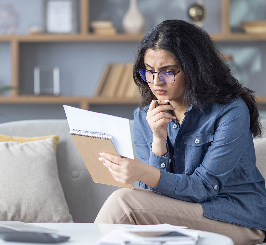 woman-on-couch-with-notebook