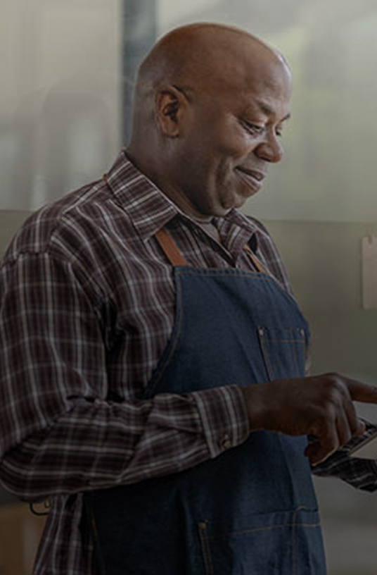 business-owner-with-welcome-sign-menu-highlight-desktop